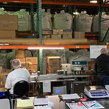 Workers packaging items in a warehouse