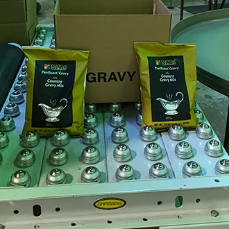 Packages of gravy mix ready for packaging