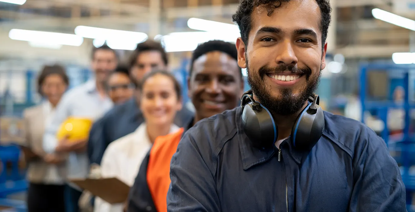 Group of smiling workers in a warehouse