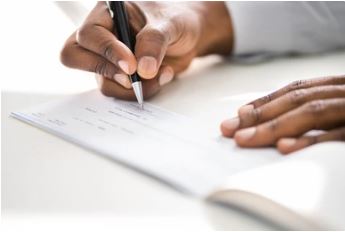 Person writing in a notebook