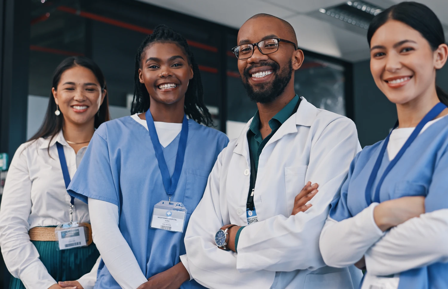 Workers in scrubs and lab coats